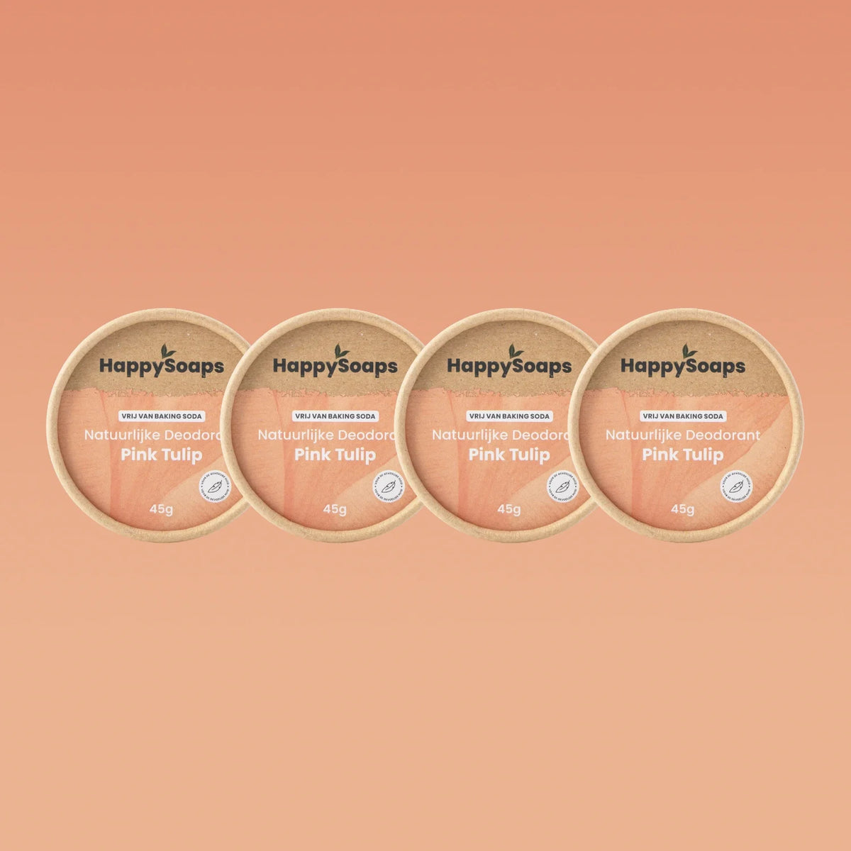 Vier potjes HappySoaps Pink Tulip deodorant van 45 gram op een perzikkleurige achtergrond
